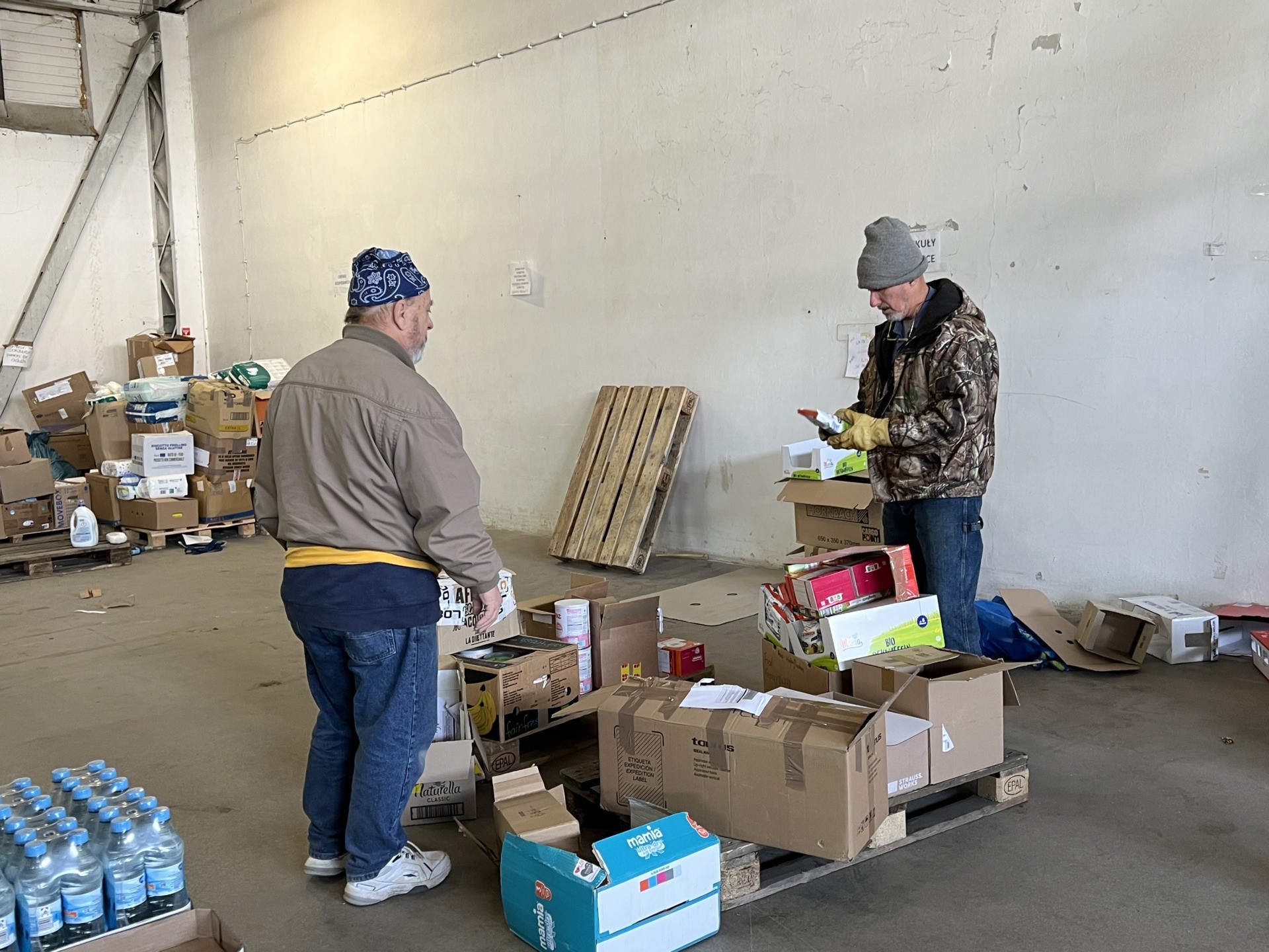 Volunteers in the warehouse (Kristina Wong/Breitbart News)