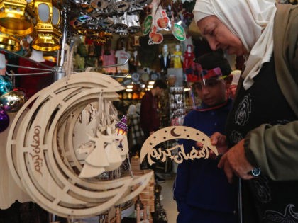 A Lebanese woman shops for decorations in preparation for the upcoming Islamic holy month