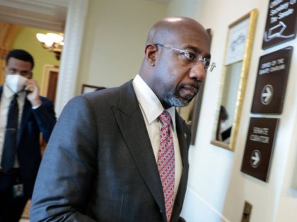Sen. Raphael Warnock (D-GA) arrives to a news conference following a virtual weekly Senate Democratic Policy meeting at the U.S. Capitol Building on January 04, 2022 in Washington, DC. During the news conference, senators spoke on numerous topics including voting rights legislation. (Photo by Anna Moneymaker/Getty Images)