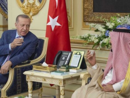 In this photo provided by the Saudi Media Ministry, Turkish President Recep Tayyip Erdogan, left, has traditional Arabic coffee, or Saudi coffee as it's also known, with Saudi Arabia's King Salman, right, at a palace in Jiddah, Saudi Arabia, Thursday, April 28, 2022. Erdogan is visiting Saudi Arabia in a …