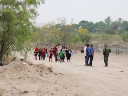 A large group of migrant family units cross the border on the eve of Easter near Eagle Pass, Texas. (Randy Clark/Breitbart Texas)