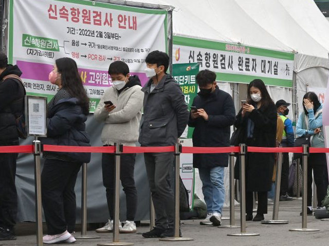 People wait in line to be tested for the Covid-19 coronavirus at a virus testing centre in