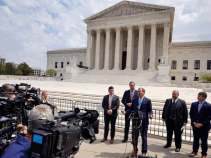 WASHINGTON, DC - APRIL 26: Texas Attorney General Ken Paxton (3rd L) talks to reporters with Missouri Attorney General Eric Schmitt (2nd L) and Texas Solicitor General Judd Stone (4th L) in front of the U.S. Supreme Court after arguments in their case about Title 42 on April 26, 2022 …
