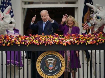 US President Joe Biden, alongside First Lady Jill Biden and two Easter bunnies, waves after speaking at the annual White House Easter Egg Roll on the South Lawn of the White House in Washington, DC, on April 18, 2022.