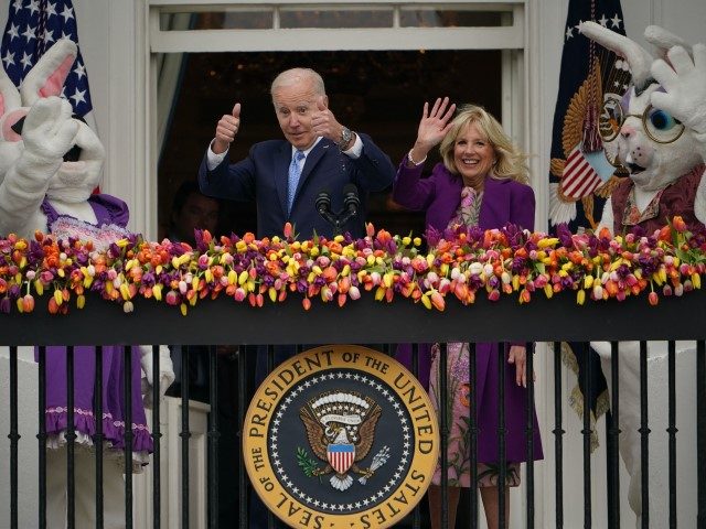 US President Joe Biden, alongside First Lady Jill Biden and two Easter bunnies, waves afte