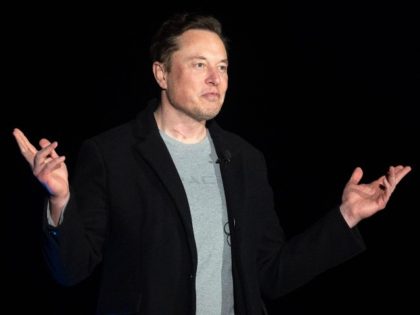Elon Musk gestures as he speaks during a press conference at SpaceX's Starbase facility near Boca Chica Village in South Texas on February 10, 2022. Billionaire entrepreneur Elon Musk delivered an eagerly-awaited update on SpaceX's Starship, a prototype rocket the company is developing for crewed interplanetary exploration.