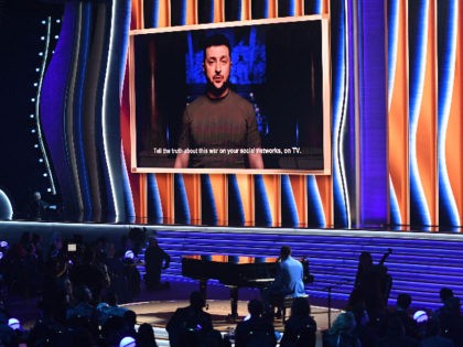 Ukraine's President Volodymyr Zelensky appears on screen during the 64th Annual Grammy Awards at the MGM Grand Garden Arena in Las Vegas on April 3, 2022. (Photo by VALERIE MACON / AFP) (Photo by VALERIE MACON/AFP via Getty Images)