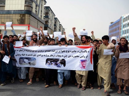 Protestors shout slogans and hold a banner during a demonstration against the Pakistani attacks, at the Martyrs' Square in Kandahar on April 18, 2022. - The death toll from Pakistani military air strikes in the eastern Afghanistan provinces of Khost and Kunar has jumped to at least 47, officials said …