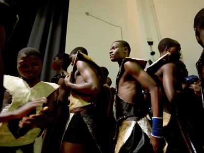 African students prepare for a performance in Hong Kong on January 5, 2012. Twenty-seven orphan students from Malawi who were trained to speak fluent Mandarin at a Taiwan-funded Buddhist orphanage in Africa performed dance and kung-fu for a group of primary school students in Hong Kong as a part of …