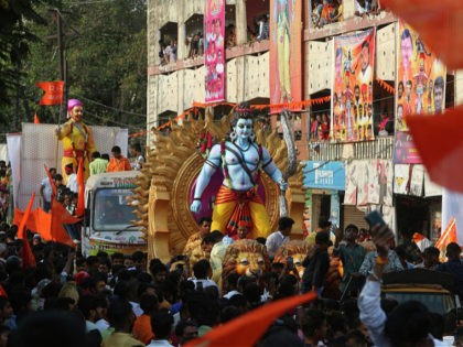 Hindu devotees accompany an idol of Hindu god Rama in a religious procession to celebrate