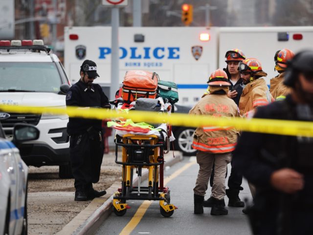 NEW YORK, NEW YORK - APRIL 12: Police and emergency responders gather at the site of a reported shooting of multiple people outside of the 36 St subway station on April 12, 2022 in the Brooklyn borough of New York City. According to authorities, multiple people have reportedly been shot …