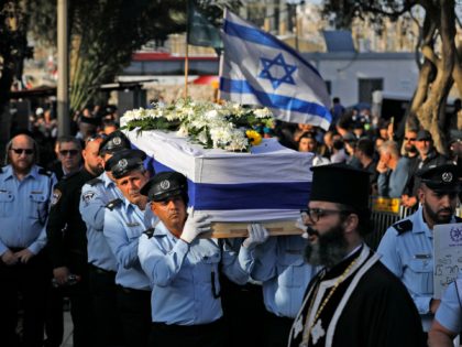 Israeli police officers carry the coffin of Israeli Arab policeman Amir Khoury, 32, one of the five people killed in a shooting attack in the religious town of Bnei Brak, during his funeral in Nazareth on March 31, 2022. (Photo by JALAA MAREY / AFP) (Photo by JALAA MAREY/AFP via …