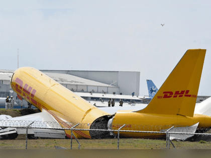 A DHL cargo plane is seen after emergency landing at the Juan Santa Maria international airport due to a mechanical problem, in Alajuela, Costa Rica, on April 7, 2022. - The two crew members onboard the plane escaped unharmed. (Photo by Ezequiel BECERRA / AFP)