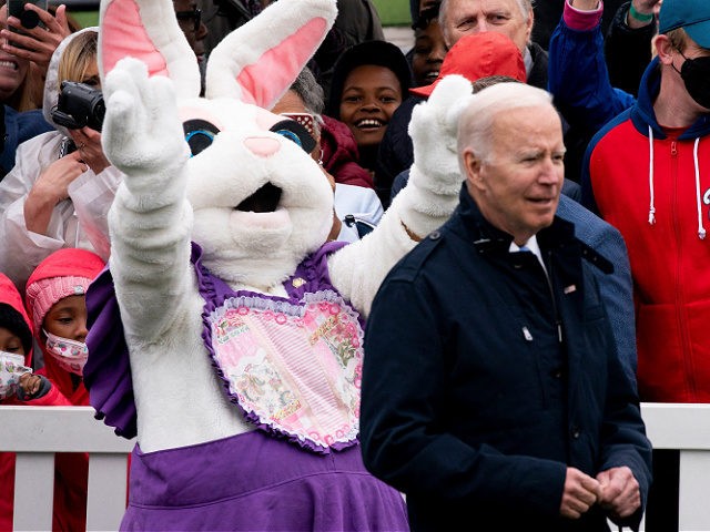 The Easter Bunny gestures to President Joe Biden during the annual Easter egg roll on the South Lawn of the White House in Washington, DC, on April 18, 2022. (Photo by Stefani Reynolds / AFP) (Photo by STEFANI REYNOLDS/AFP via Getty Images)