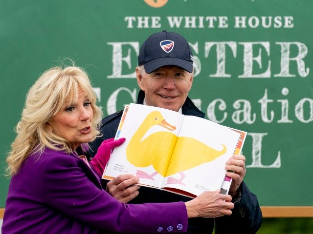 President Joe Biden helps first lady Jill Biden read Brown Bear Brown Bear during the White House Easter Egg Roll at the White House, Monday, April 18, 2022, in Washington. (AP Photo/Andrew Harnik)