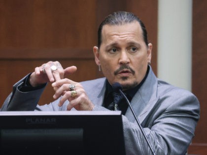 Actor Johnny Depp testifies during a hearing in the courtroom at the Fairfax County Circui
