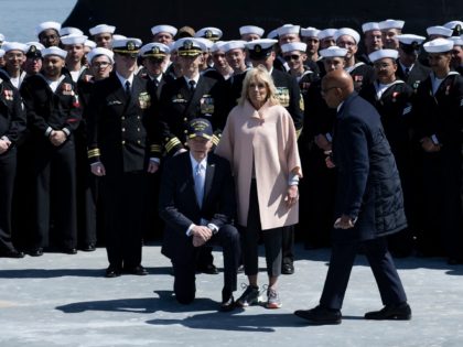 US President Joe Biden and First Lady Jill Biden pose with the crew after the commissioning commemoration ceremony for the Virginia-Class submarine USS Delaware at the Port of Wilmington in Wilmington, Delaware, on April 2, 2022. (Photo by Brendan Smialowski / AFP) (Photo by BRENDAN SMIALOWSKI/AFP via Getty Images)