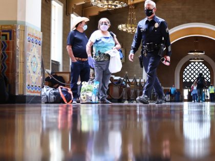 LOS ANGELES, CALIFORNIA - JULY 19: People wear face coverings as they gather in Union Station on July 19, 2021 in Los Angeles, California. A new mask mandate went into effect just before midnight on July 17th in Los Angeles County requiring all people, regardless of vaccination status, to wear …