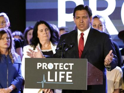 Florida Gov. Ron DeSantis speaks to supporters before signing a 15-week abortion ban into law Thursday, April 14, 2022, in Kissimmee, Fla. The move comes amid a growing conservative push to restrict abortion ahead of a U.S. Supreme Court decision that could limit access to the procedure nationwide. (AP Photo/John …