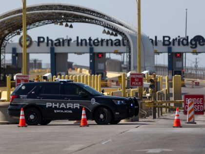 PHARR, TX - APRIL 13: Police officers block the entrance to the Pharr-Reynosa International Bridge on April 13, 2022 in Pharr, Texas. Mexican truckers have suspended traffic since at least April 9, 2022 at the bridge in protest of Texas Governor Abbotts new inspection mandate. (Photo by Michael Gonzalez/Getty Images)