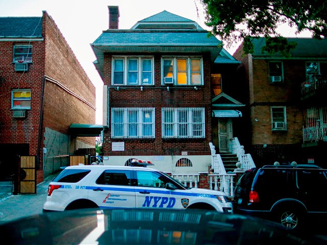 A New York City Police department vehicle is parked in front of the Kamway Lodge in the Queens borough of New York, Thursday, Aug. 22, 2019. Police say the body of Andrea Zamperoni, a chef at a popular restaurant in New York's Grand Central Terminal who went missing the previous weekend, was found at the hostel earlier in the day. (AP Photo/Eduardo Munoz Alvarez)