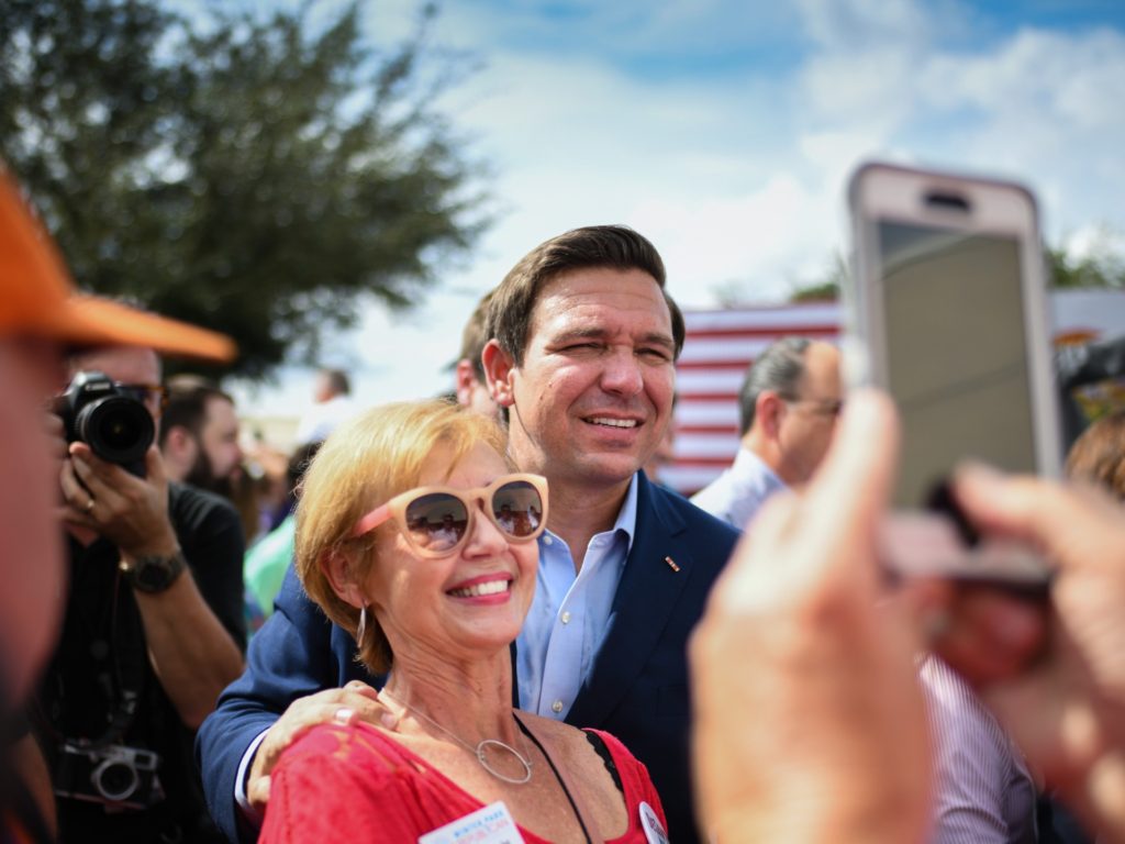 ORLANDO, FLORIDA - NOVEMBER 05: Republican candidate for Governor of Florida Ron DeSantis meets supporters as they attend a rally at Freedom Pharmacy on the final day of campaigning in the midterm elections on November 5, 2018 in Orlando, Florida. DeSantis is running against Democratic candidate Andrew Gillum to be the next Florida governor. (Photo by Jeff J Mitchell/Getty Images)