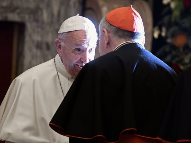 Pope Francis speaks with cardinals after the annual address to the Church's governing Curia at the Vatican on December 21, 2018 at the Vatican. (Photo by Filippo MONTEFORTE / AFP) (Photo credit should read FILIPPO MONTEFORTE/AFP via Getty Images)