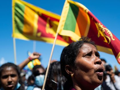 People shout slogans during an ongoing anti-government demonstration outside the president's office in Colombo on April 15, 2022, demanding the resignation of President Gotabaya Rajapaksa over the country's crippling economic crisis. (Photo by Jewel SAMAD / AFP) (Photo by JEWEL SAMAD/AFP via Getty Images)
