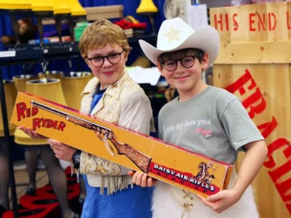In this Oct. 26, 2012, photo, Joe West, left, and Johnny Rabe hold a Red Ryder BB Gun, one of the props from "A Christmas Story, the Musical" in New York. Both 12-year-old boys are making their Broadway debuts playing Ralphie in the stage adaptation of the cult 1983 film. …