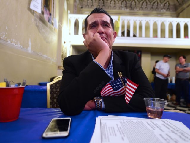 OPSHOT - An emotional Gerardo Ruiz watches the Election results from the headquarters of US Democratic presidential Hillary Clinton in East Los Angeles on November 8, 2016. / AFP / Frederic J. BROWN (Photo credit should read FREDERIC J. BROWN/AFP via Getty Images)