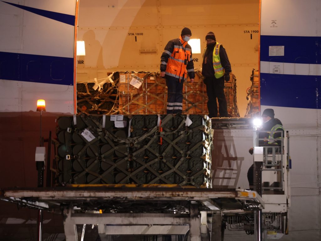 BORYSPIL, UKRAINE - JANUARY 25: Ground personnel unload weapons, including Javelin anti-tank missiles, and other military hardware delivered on a National Airlines plane by the United States military at Boryspil Airport near Kyiv on January 25, 2022 in Boryspil, Ukraine. The shipment comes as tensions between the NATO military alliance and Russia are intensifying due to Russia's move of tens of thousands of troops as well as heavy weapons to the Ukrainian border, causing international fears of a possible Russian invasion of Ukraine. The U.S., Great Britain and other NATO countries have sent arms in recent days to Ukraine in a bid to deter an invasion. (Photo by Sean Gallup/Getty Images)