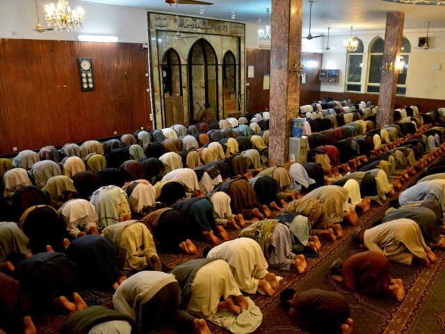 Afghan Muslims offer prayers on the first night of Islam's holy month of Ramadan at the Wa