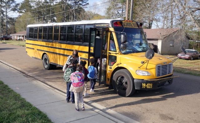 Children leave Wilkins Elementary school in Jackson, Mississippi, to use the bathroom at a neighboring school because theirs lacks the water pressure needed to flush the toilets