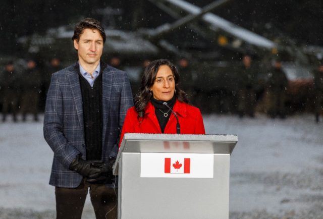 Canadian Defense Minister Anita Anand -- seen here with Prime Minister Justin Trudeau dur