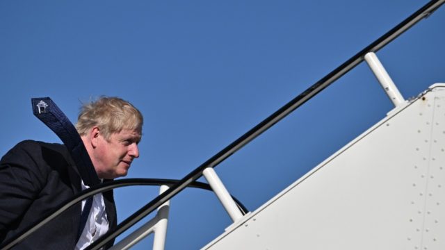 Britain's Prime Minister Boris Johnson is facing a parliamentary vote about whether he sho