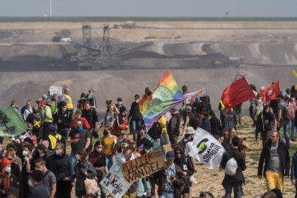 Protesters in front of the the Garzweiler lignite open cast mine on Saturday