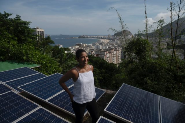 Solars panels installed atop roofs in Rio's Babilonia favela have helped residents lower e