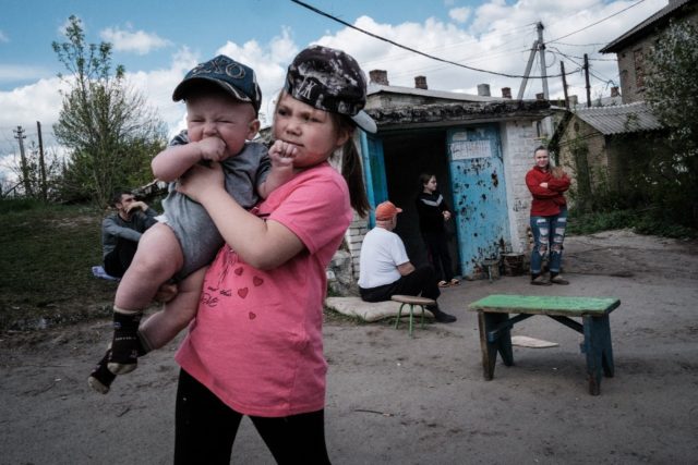 In Ukraine's industrial Donbas region, some residents say they would welcome a Russian tak