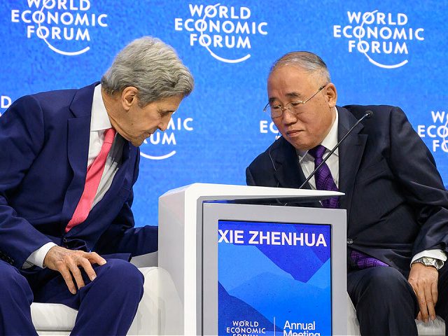 US climate envoy John Kerry (L) attends next to China's special climate envoy Xie Zhenhua