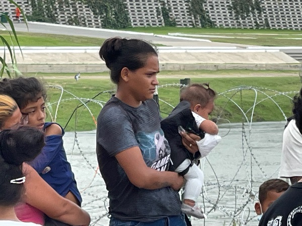 Migrant mothers wait with their small children after illegally crossing the Rio Grande from Mexico. (Randy Clark/Breitbart Texas)