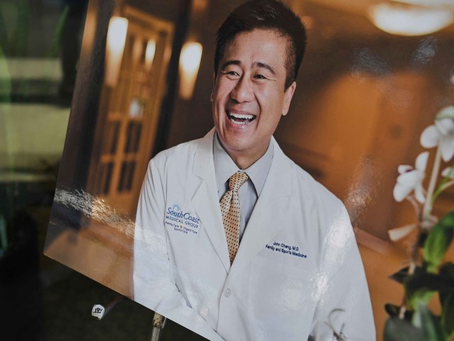 A photo of Dr. John Cheng is seen outside his office in Aliso Viejo, California, May 16, 2022. - Cheng, 52, a family and sports medicine doctor was killed protecting others when a gunman opened fire at church services he was attending in nearby Laguna Woods, California on May 15, 2022. Cheng charged the gunman in a bid to bring him to the ground, allowing others to hogtie him, but was fatally hit by the gunfire. (Photo by Robyn Beck / AFP) (Photo by ROBYN BECK/AFP via Getty Images)