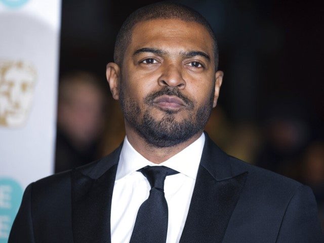 Noel Clarke poses for photographers upon arrival at the BAFTA Film Awards in London, Sunda