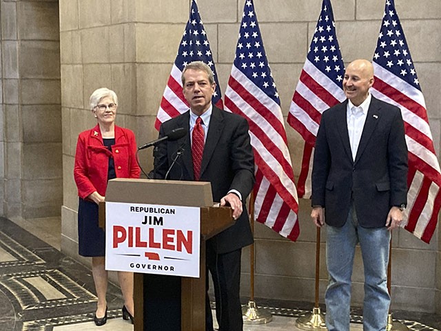 Nebraska Republican gubernatorial candidate Jim Pillen, center, talks about his campaign after receiving an endorsement from Gov. Pete Ricketts, right on Tuesday, Jan. 18, 2022, at the state Capitol in Lincoln, Neb. Pillen is in a crowded primary race to succeed Ricketts, who leaves office next year because term limits, and he's been endorsed by former Gov. Kay Orr, left. (AP Photo/Grant Schulte)