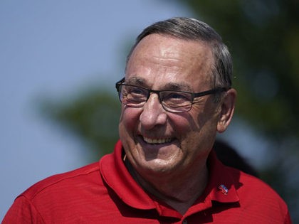 FILE- Former Gov. Paul LePage marches in the State of Maine Bicentennial Parade in this Aug. 21, 2021, file photo, in Lewiston, Maine. The campaign for LePage, who is challenging current Democratic Gov. Janet Mills, said it has raised almost $900,000 so far. (AP Photo/Robert F. Bukaty, file)