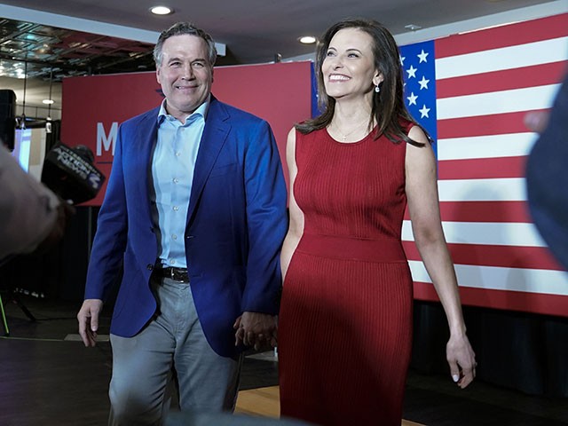 Pennsylvania Republican US Senate candidate Dave McCormick and his wife Dina Powell wave to supporters as they arrive at their Pennsylvania primary election results watch party, Tuesday, May 17, 2022, in Pittsburgh.  (AP Photo/Keith Srakocic)