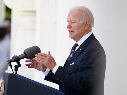 President Joe Biden speaks at the Memorial Amphitheater after laying a wreath at The Tomb