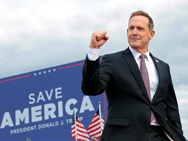 Republican candidate for U.S. Senate Ted Budd, of North Carolina, exits after speaking to the crowd before former President Donald Trump takes the stage at a rally Saturday, April 9, 2022, in Selma, N.C. (AP Photo/Chris Seward)