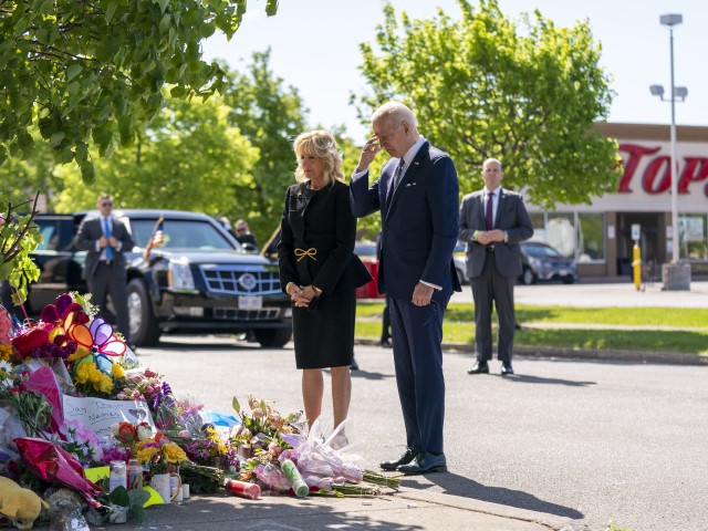 President Joe Biden and first lady Jill Biden visit the scene of a shooting at a supermarket to pay respects and speak to families of the victims of Saturday's shooting in Buffalo, N.Y., Tuesday, May 17, 2022. (AP Photo/Andrew Harnik)