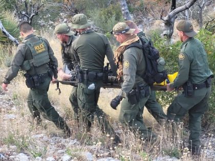 Brian A. Terry Station Border Patrol agents carry an injured migrant woman out of the Huachuca mountains near the Arizona Border with Mexico. (U.S. Border Patrol/Tucson Sector)