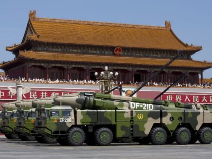 FILE - In this Sept. 3, 2015, file photo, Chinese military vehicles carrying DF-21D anti-ship ballistic missiles, potentially capable of sinking a U.S. Nimitz-class aircraft carrier in a single strike, pass by Tiananmen Gate during a military parade to commemorate the 70th anniversary of the end of World War II, …